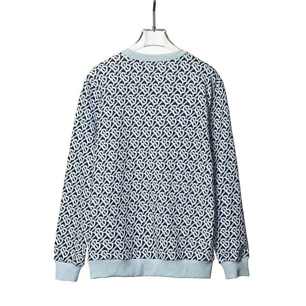 Side angle showing oversized fit of Burberry Women Monogram Print Cotton Sweatshirt