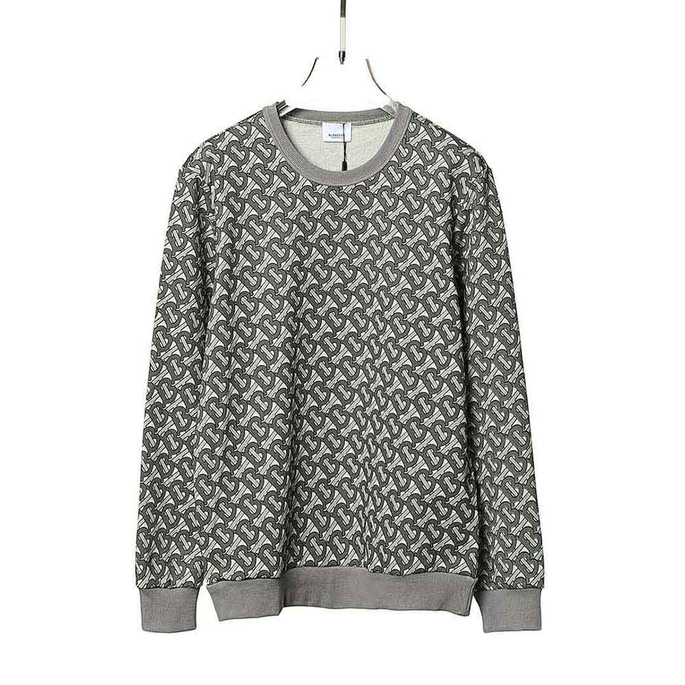 Close-up detail of silver monogram print on Burberry sweatshirt