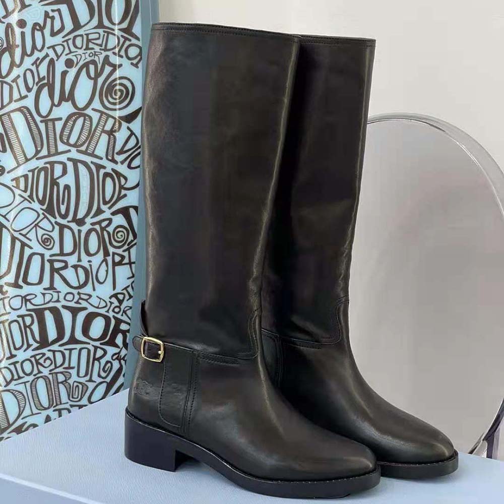 Close-up of polished silver buckle on Celine Women Folco Buckled Boot