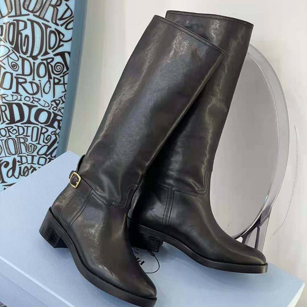 Front view of sleek silhouette on Celine Women Folco Buckled Boot