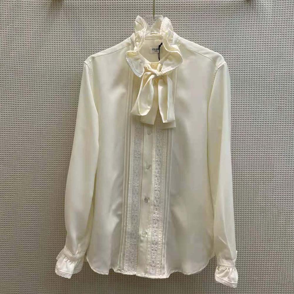 Close-up on broderie anglaise embroidery detail on Celine loose shirt