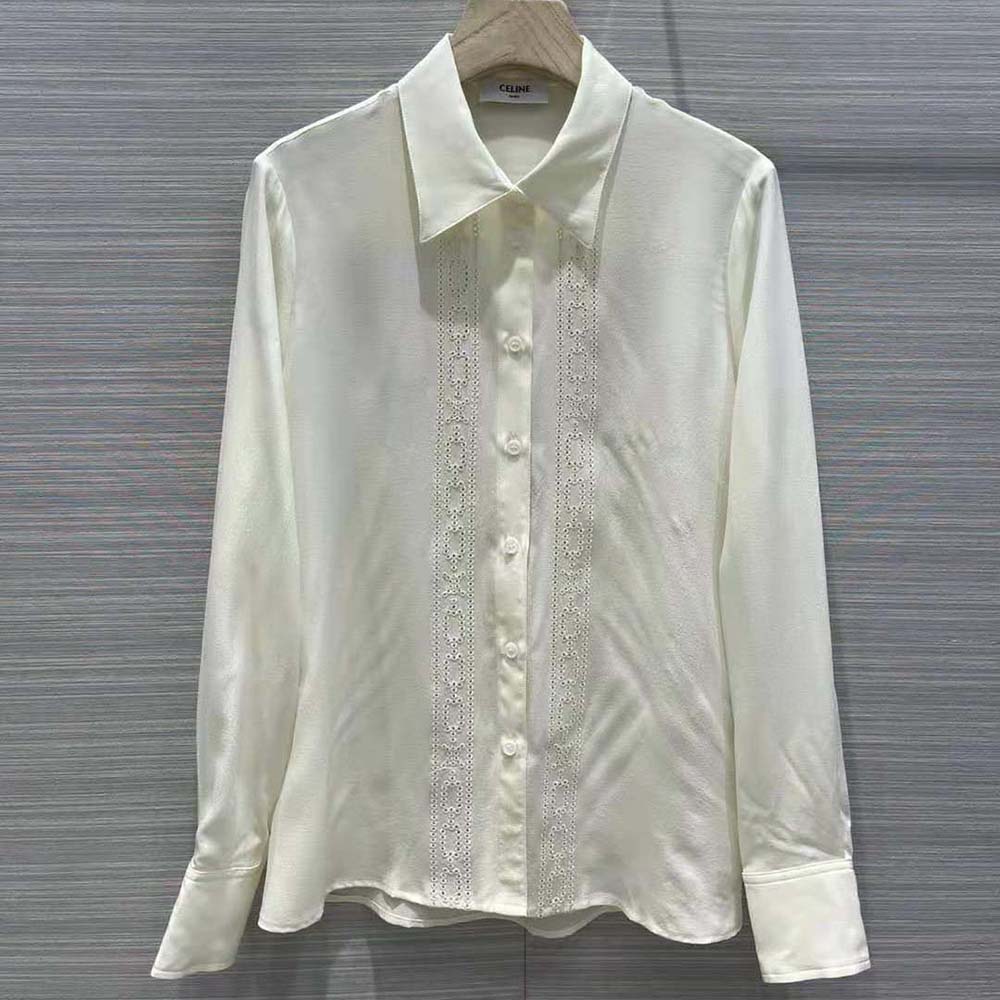 Close-up of broderie anglaise embroidery detail on Celine white shirt