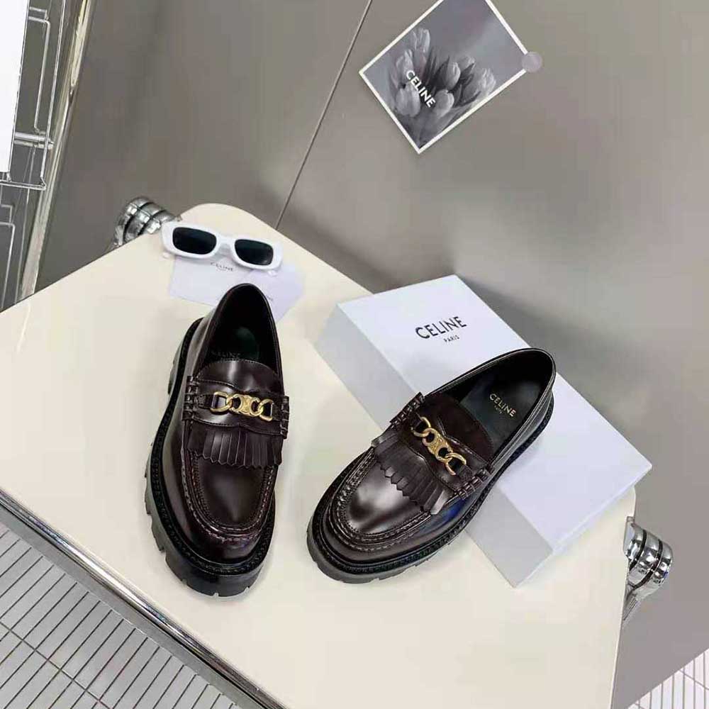 Overhead shot showing polished bull leather texture of Celine Women Margaret Loafer