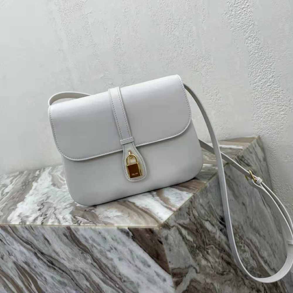 Close-up of polished gold hardware on Celine Medium Tabou bag