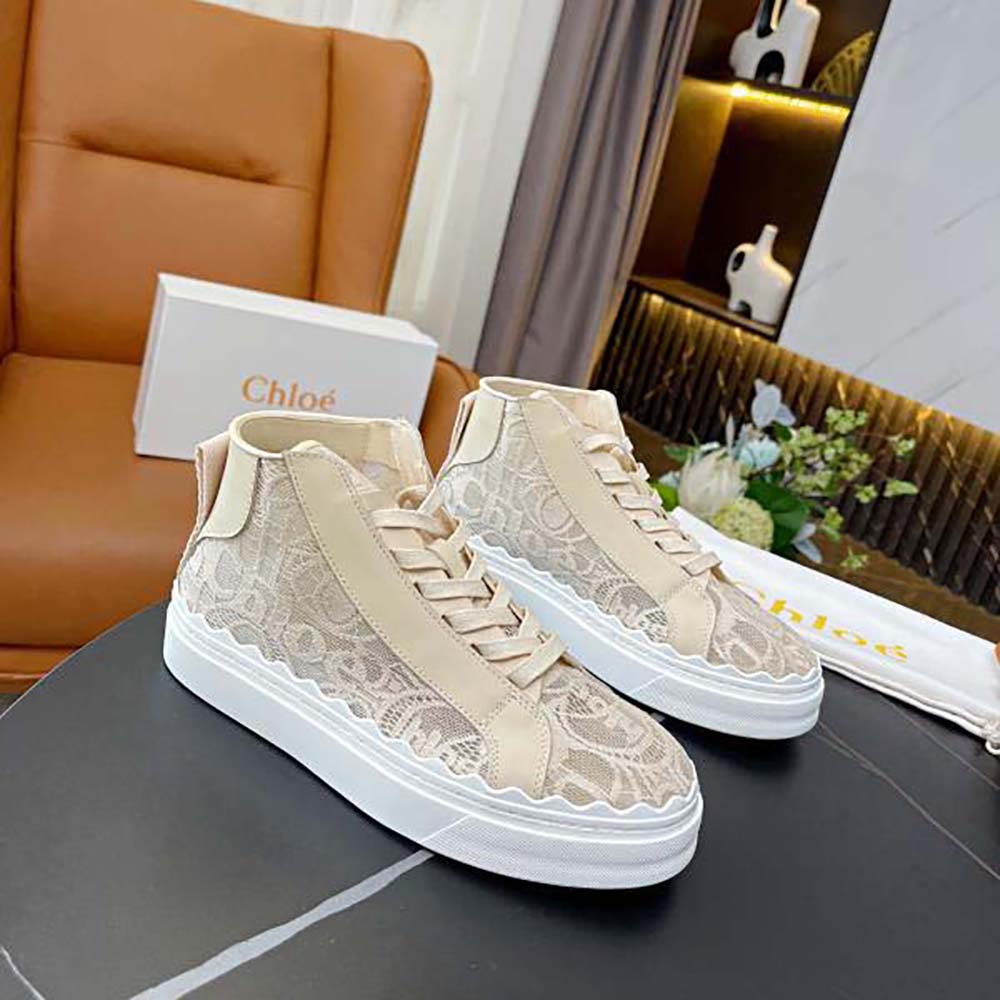 Close-up of lace overlay and gold hardware on Chloe Women Lauren High-Top Sneaker