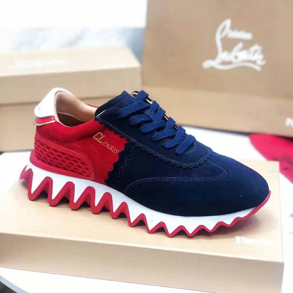 Close-up of signature spikes on Christian Louboutin Women Loubishark Flat-Navy