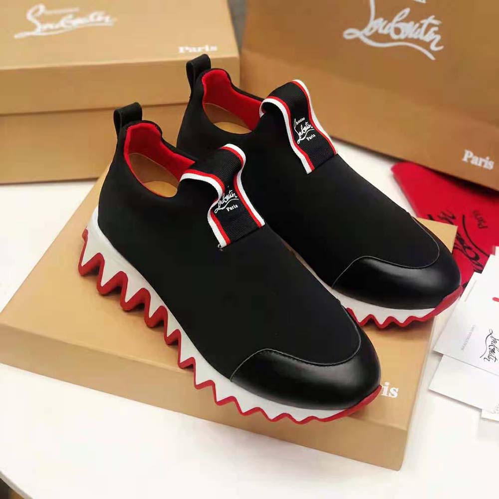 Top angle showing black leather and laces of Tiketa Run-Black sneakers