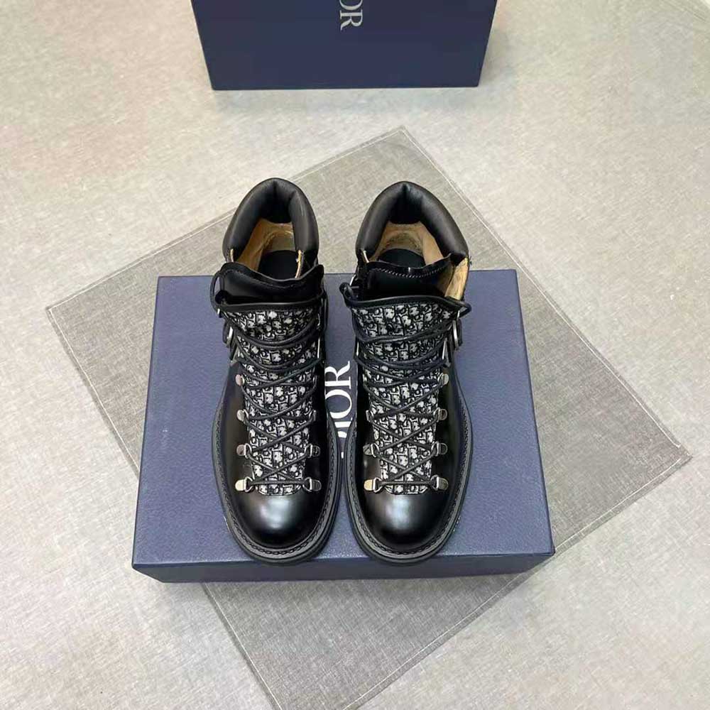 Close-up of black leather and silver buckle on Dior Men Explorer II Boot