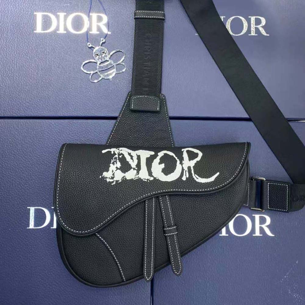 Close-up of silver-toned closure on Dior Men Peter Doig Saddle Bag