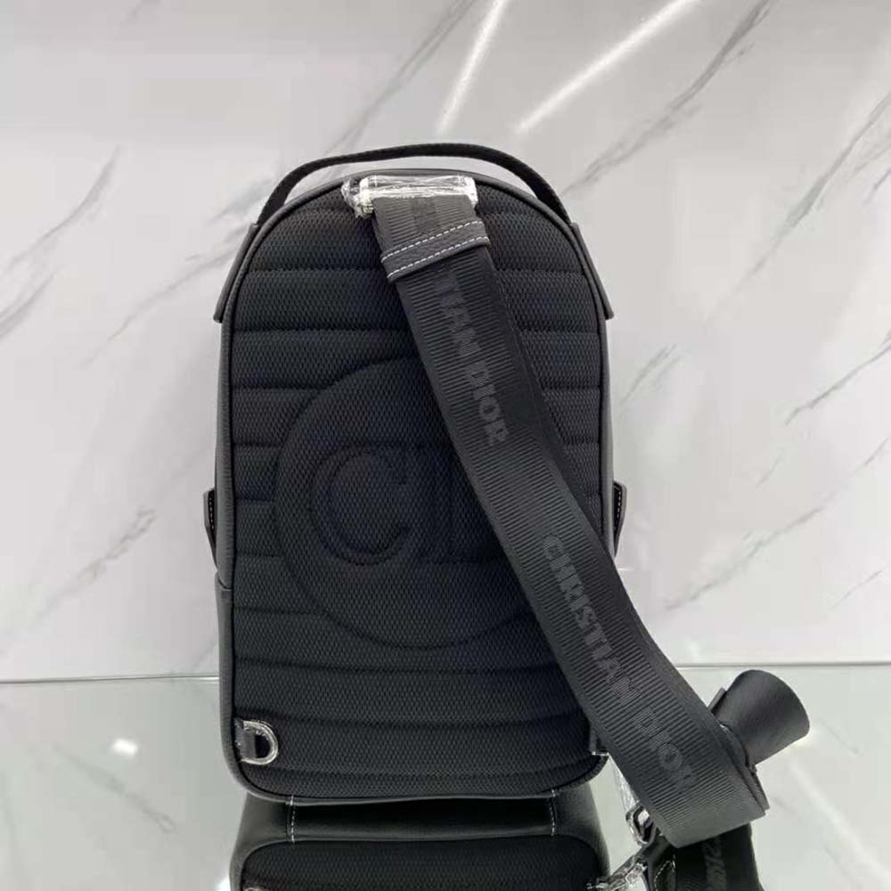 Side angle showing slim silhouette of Dior Men Peter Doig Sling Bag