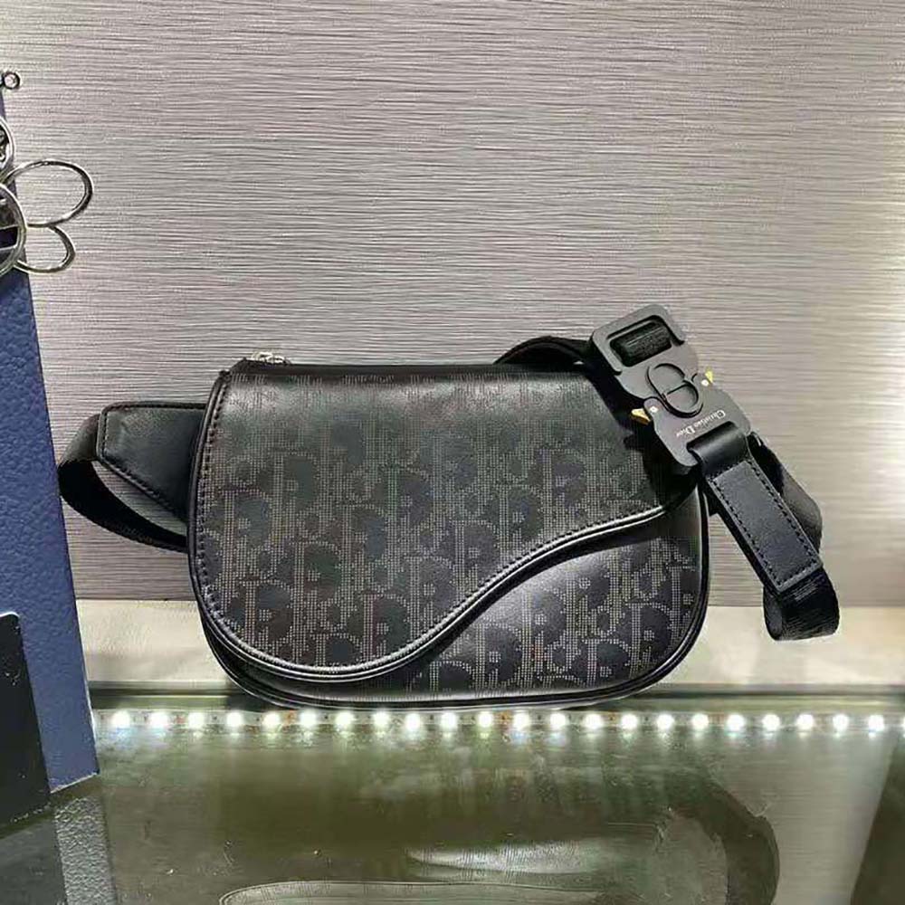 Close-up on silver hardware of Dior Men World Tour Saddle Belt Bag black leather