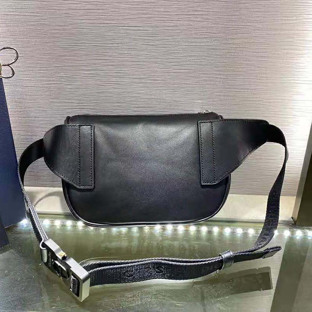 Side angle showing strap details of Dior Men World Tour Saddle Belt Bag