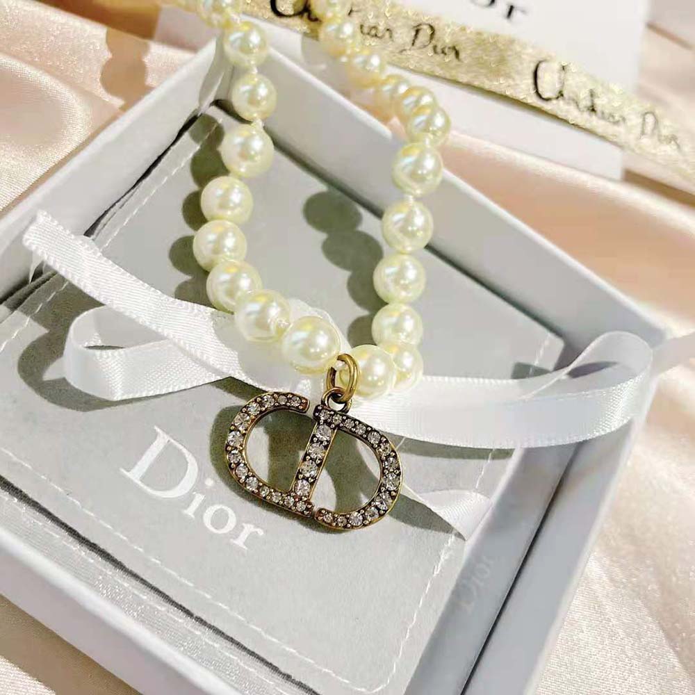 Close-up of white resin pearls on Dior Women 30 Montaigne Choker