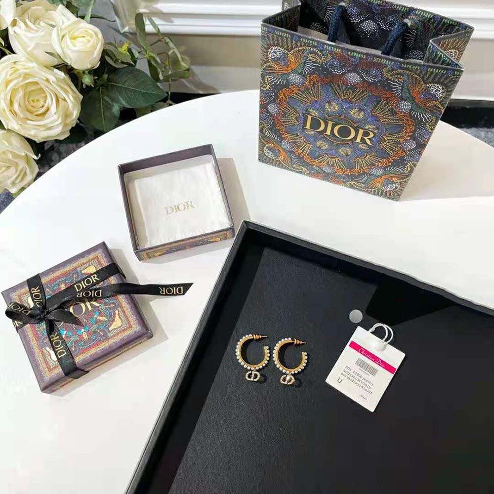 Front view of Dior Women 30 Montaigne Earrings in antique gold metal