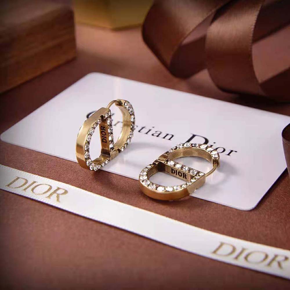 Side angle showing elegant drop silhouette of Dior Women 30 Montaigne Earrings