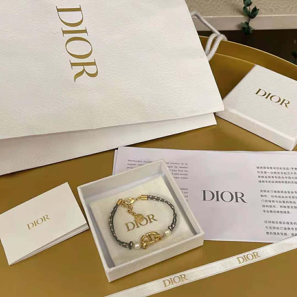 Side view showing navy blue and gold-finish metal on Dior Women CD Navy Bracelet