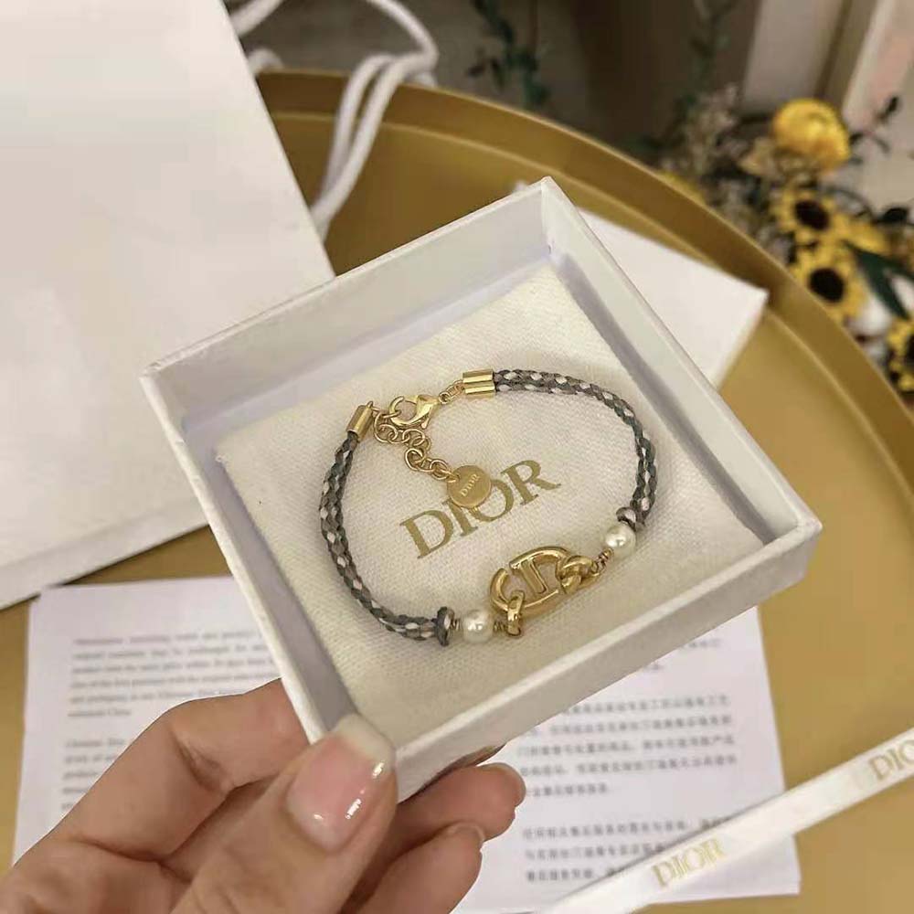 Dior Women CD Navy Bracelet Gold-Finish Metal worn on wrist, angled shot