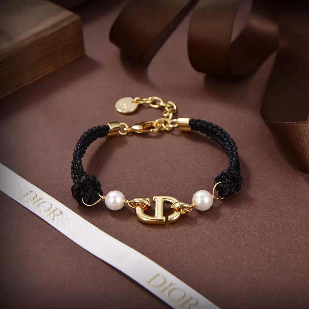Side view of Dior Women CD Navy Bracelet featuring black cotton and clasp