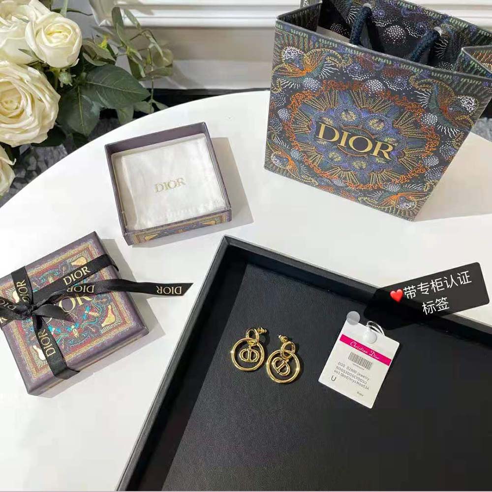 Close-up of gold-finish metal and secure closure on Dior Women CD Navy Earrings