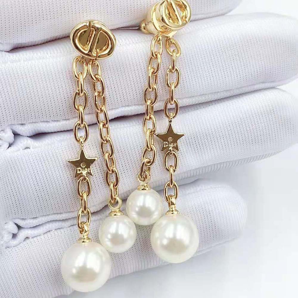 Side angle showing drop silhouette of Dior Women CD Navy Earrings