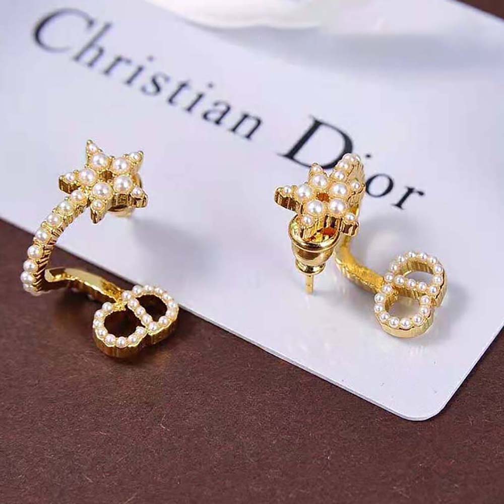 Side profile showing gold-finish metal and closure of Dior Earrings
