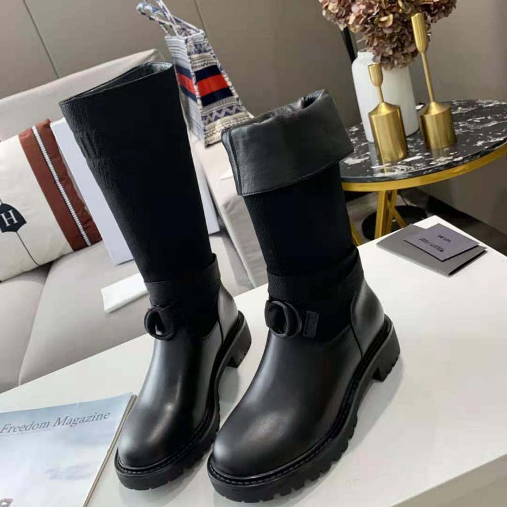 Close-up on signature Dior hardware of D-Major Boot in black
