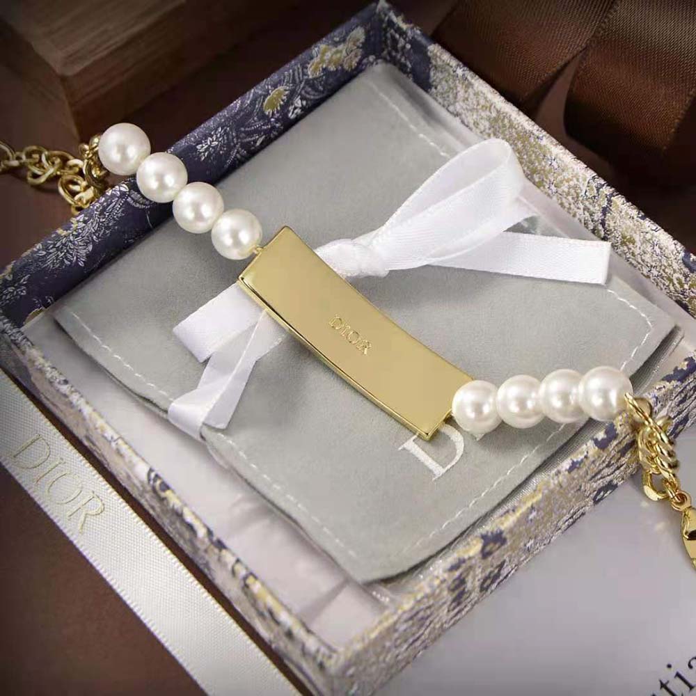 Side angle capturing the gold-finish and signature logo of Dior Women Dior-ID Bracelet