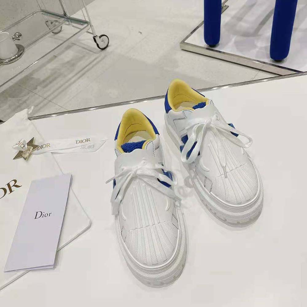Close-up of blue terry cotton and Dior logo on sneaker