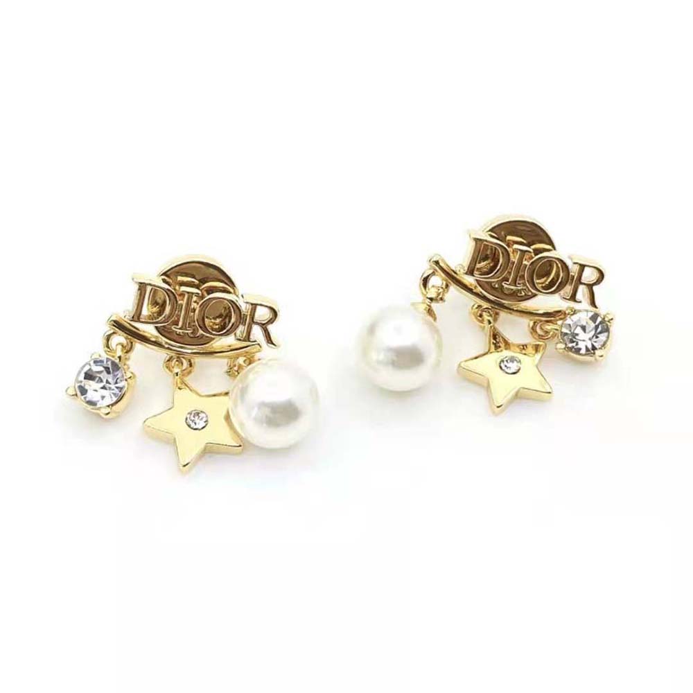 Close-up on white resin pearls and white crystals detail