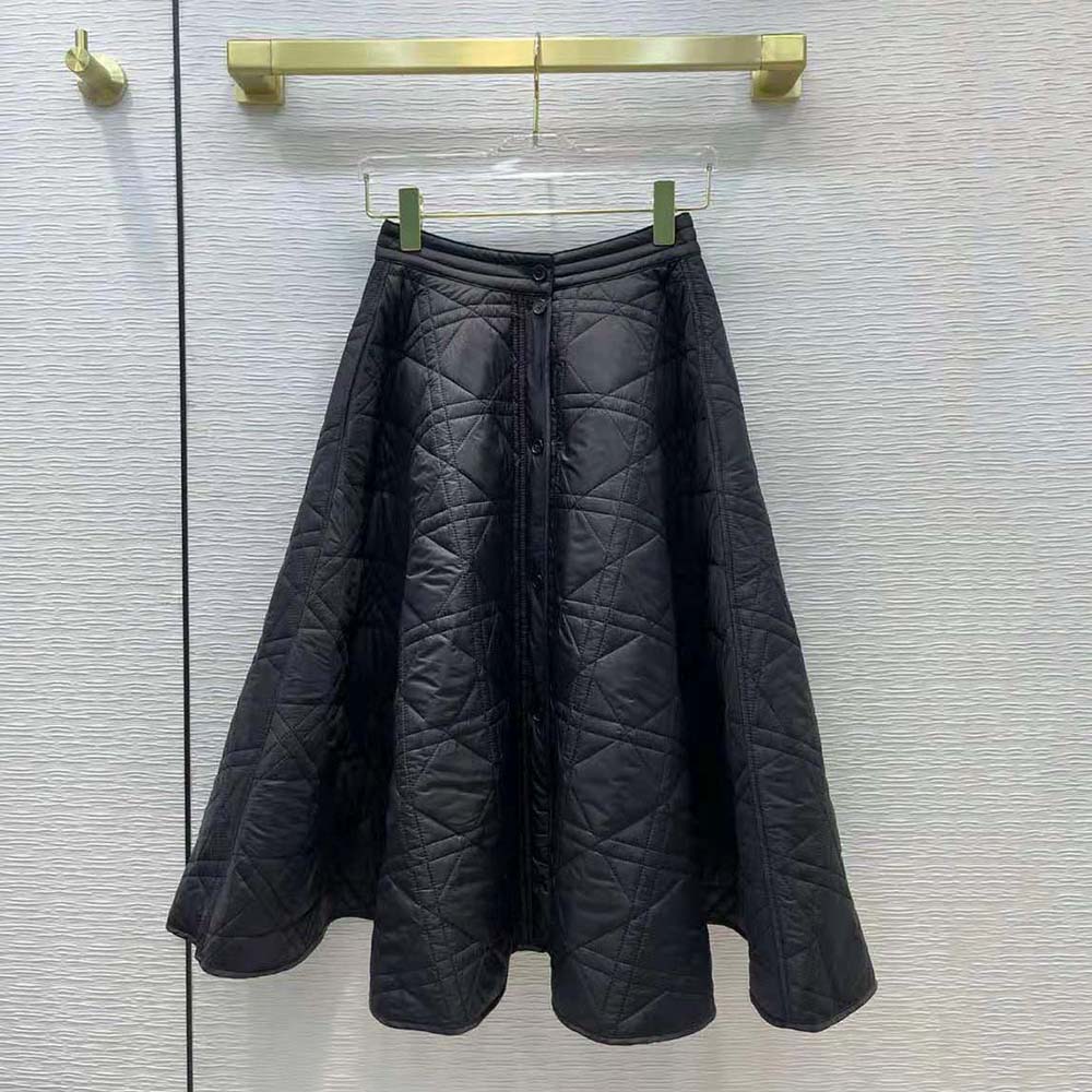 Close-up of signature Macrocannage quilting detail on Dior black skirt