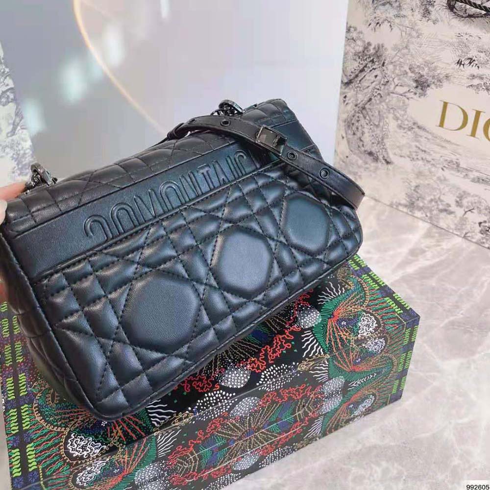 Side angle showcasing stitching and silhouette of Dior Women Medium Dior Caro Bag