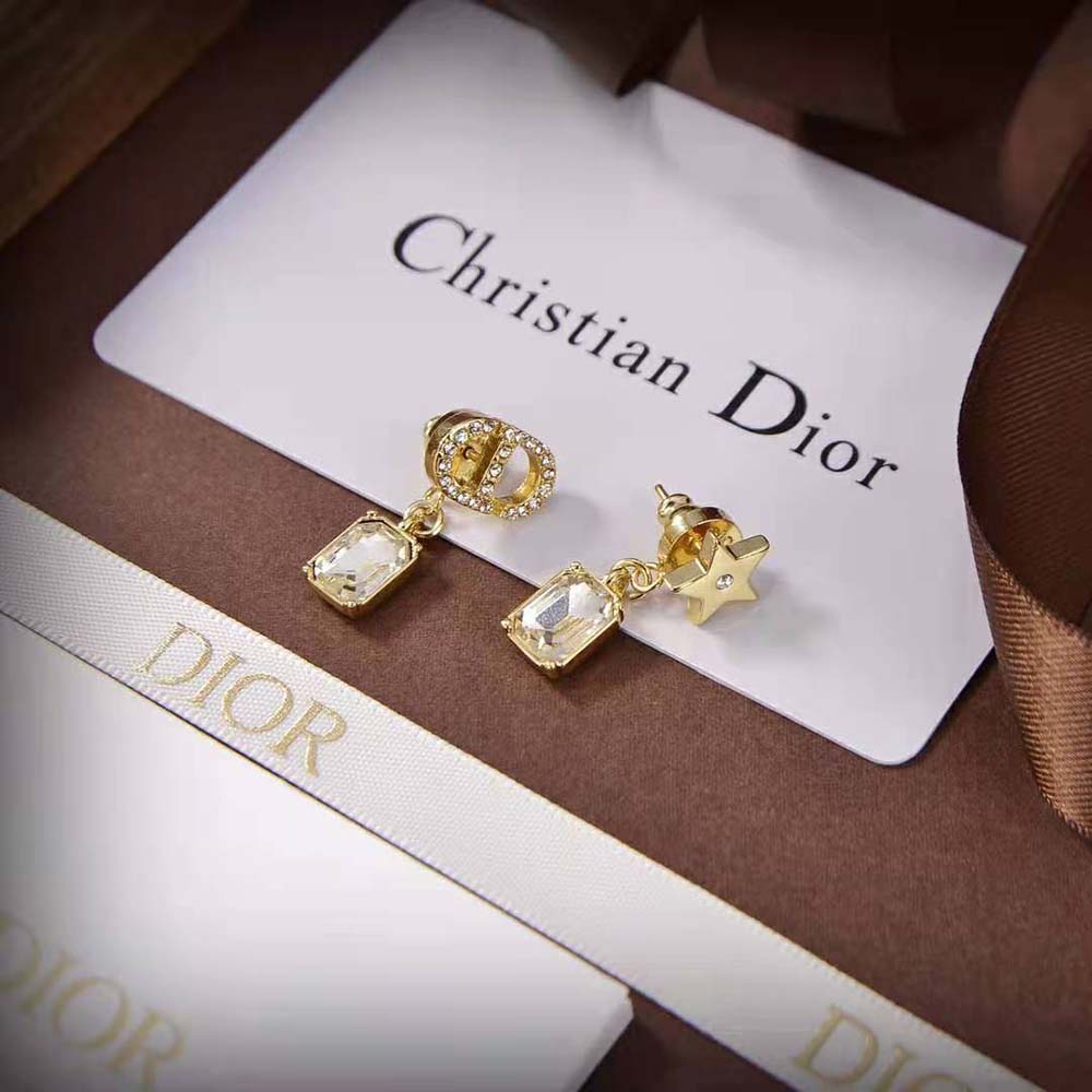 Side angle showing delicate silhouette of Dior Women Petit CD Earrings