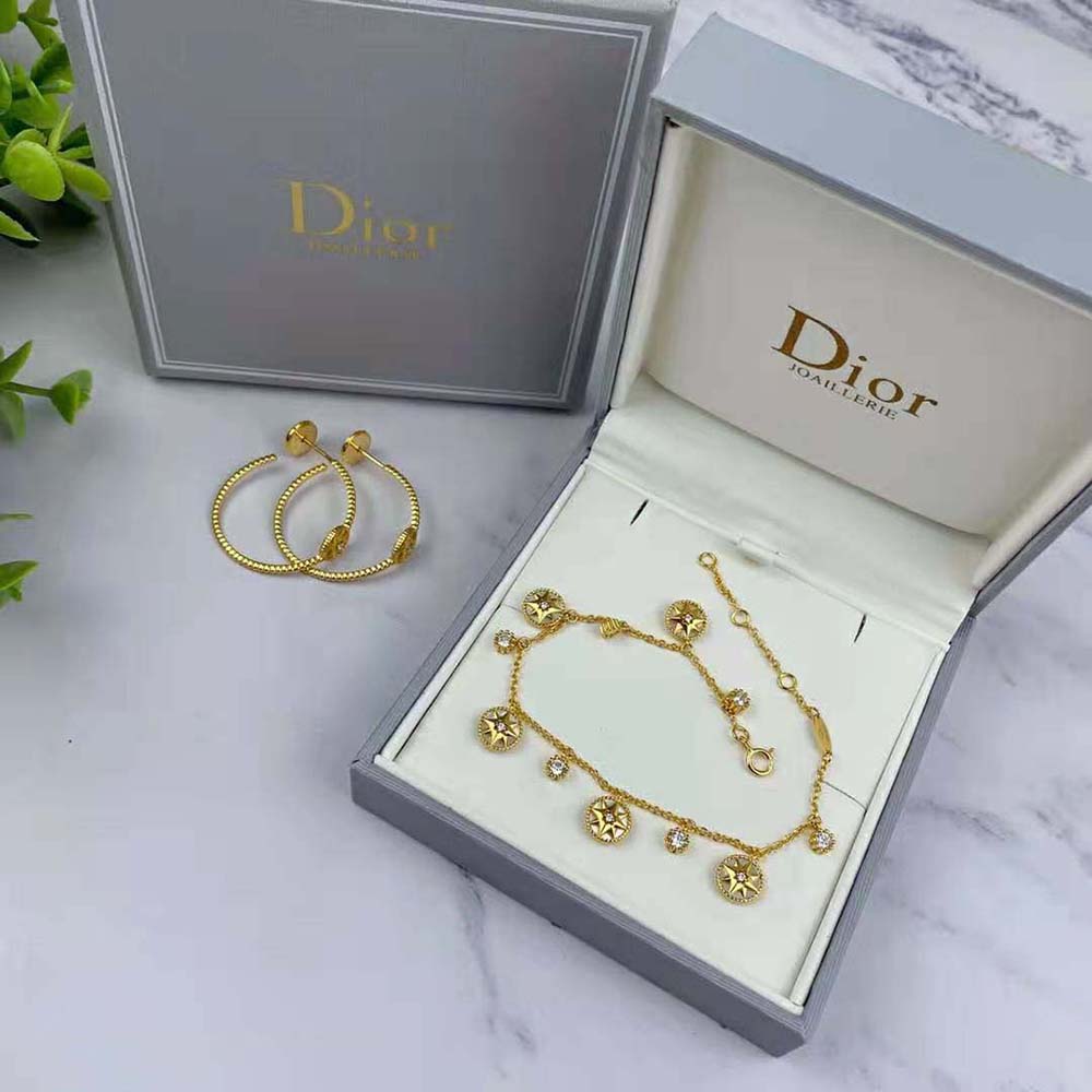 Side angle of Dior Women Rose Des Vents bracelet in yellow gold with signature motif