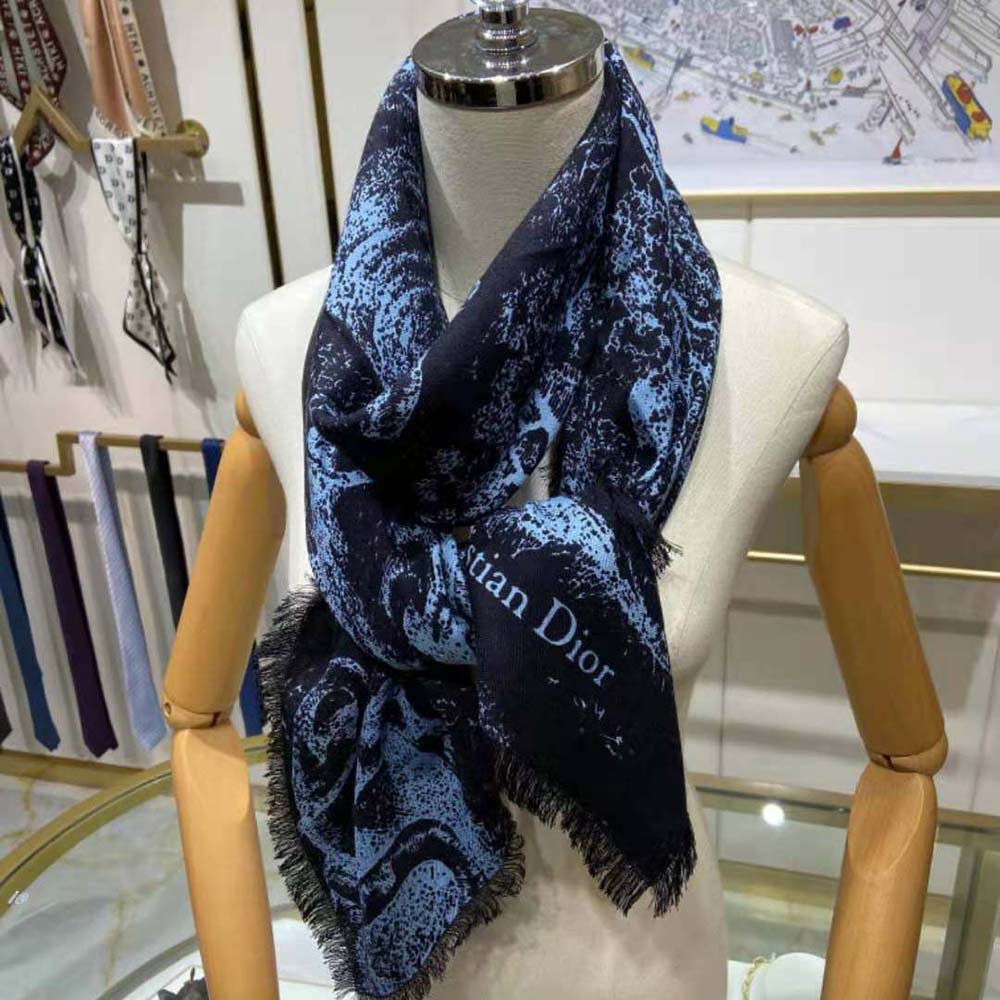 Close-up of Dior Toile de Jouy print detail on navy silk twill scarf