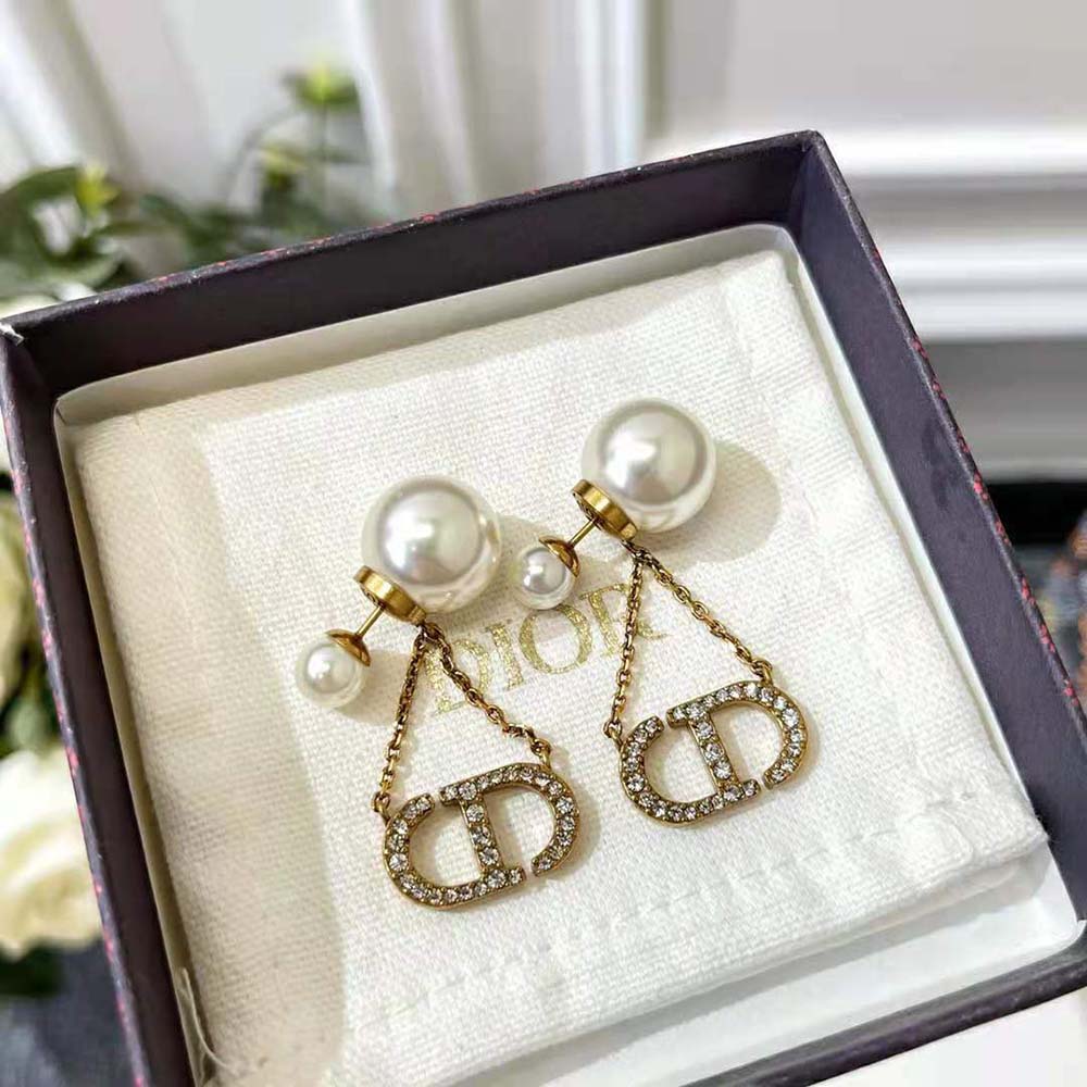 Side angle showcasing push-back closure of Dior Women Tribales Earrings Antique Gold