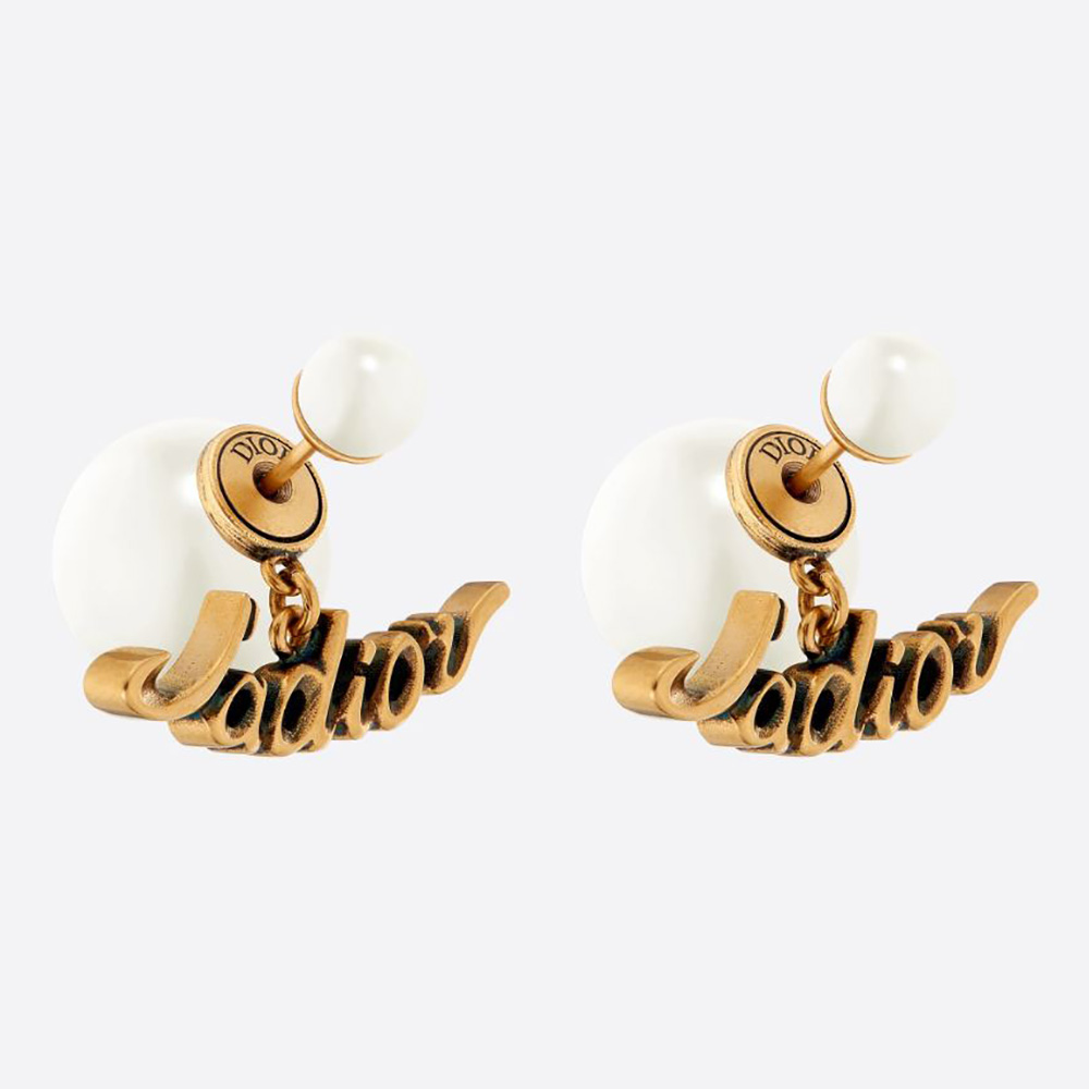 Close-up of Dior Women Tribales Earrings antique gold and white pearls
