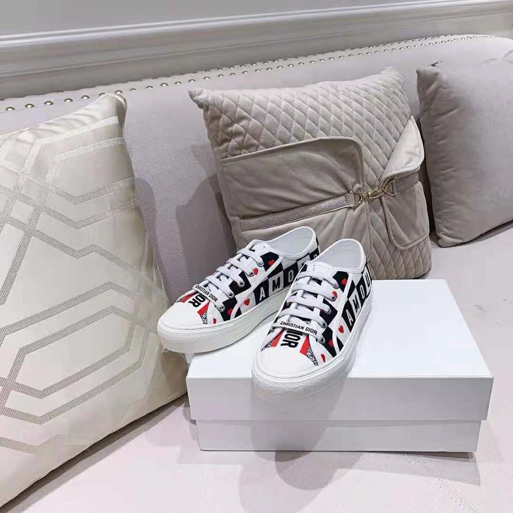 Close-up on silver-tone Dior logo hardware on Dior Women Walk N Dior Dioramour Sneaker