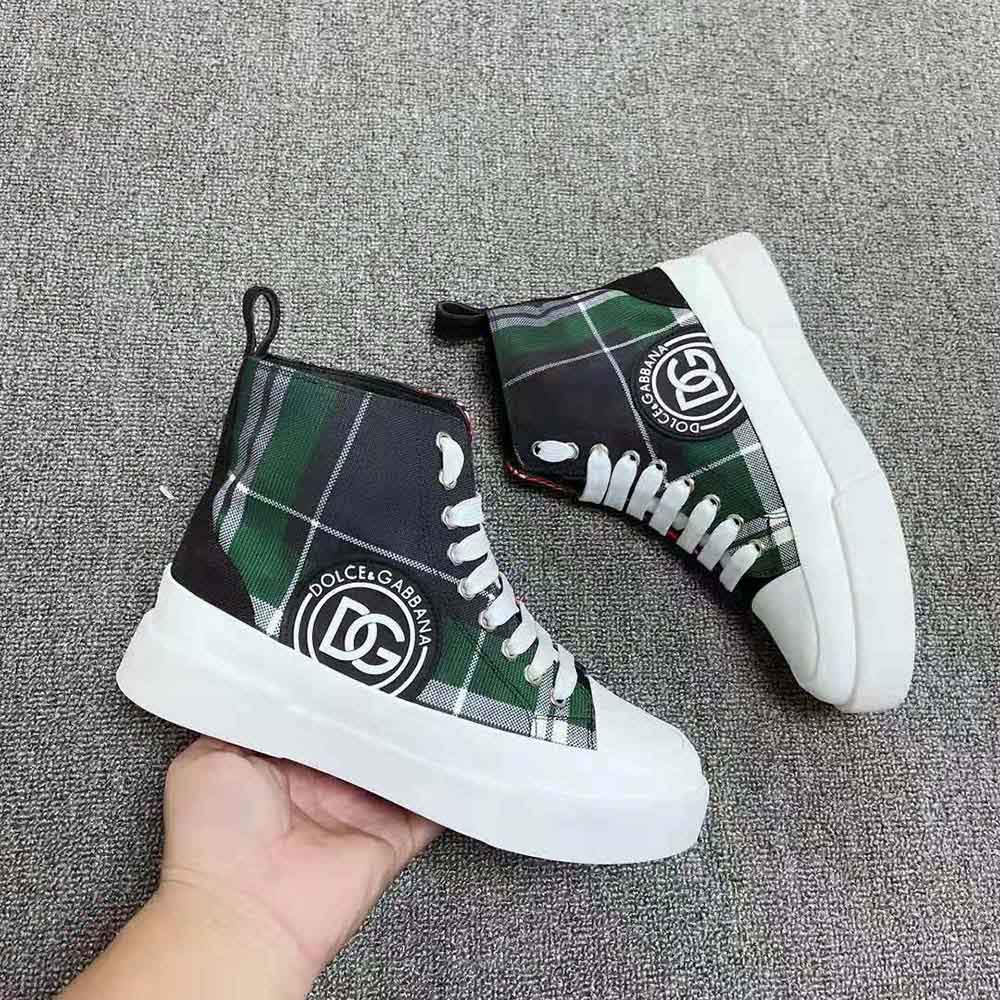 Close-up on tartan fabric and leather detail of Dolce Gabbana D&G mid-top sneakers