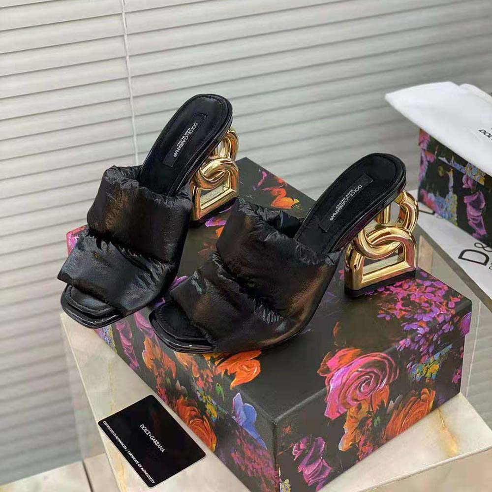 Close-up on DG Pop logo heel detail of Dolce Gabbana D&G black mules