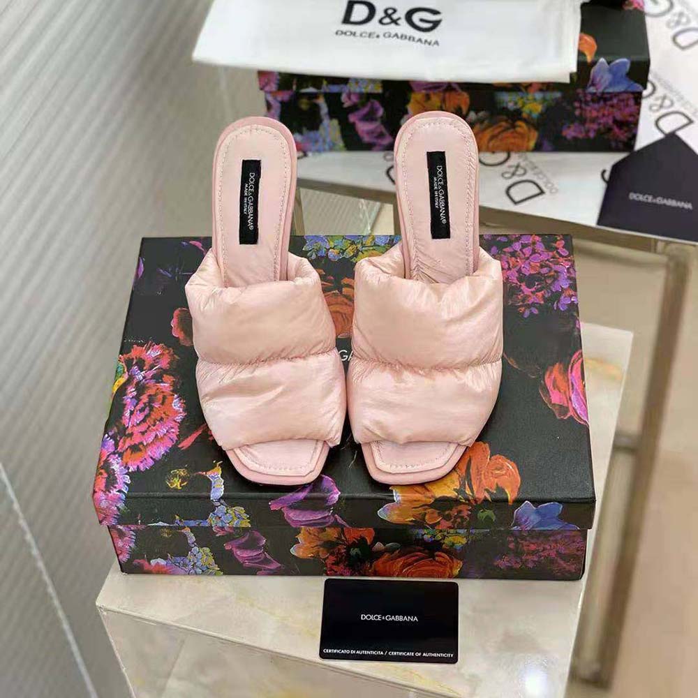 Close-up of signature DG pop heel on pink down-padded mules