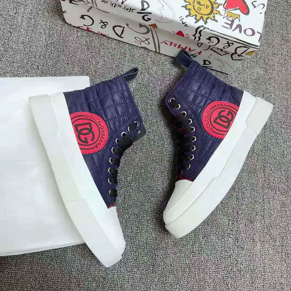 Top view of navy mid-top sneakers showing lace-up closure and padded collar