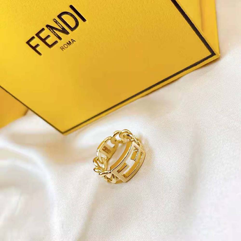 Fendi Women Baguette Chain Gold-Colored Ring styled on model’s hand in natural light