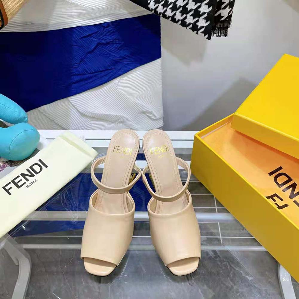 Close-up on gold-tone logo detail of Fendi Women First sandals
