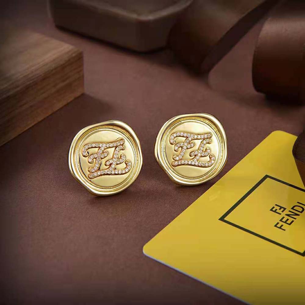 Close-up of polished gold finish on Fendi Women Karligraphy Earrings