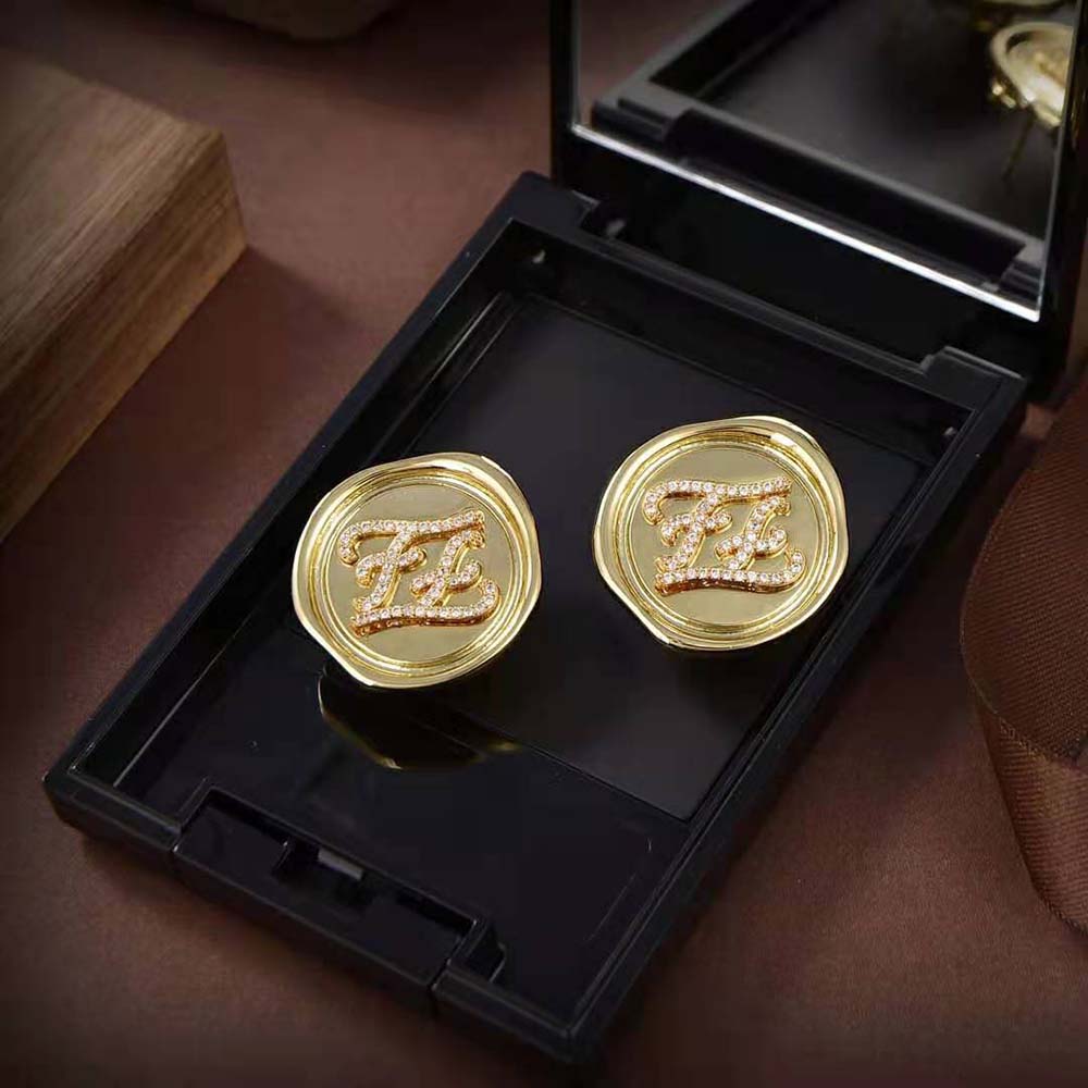Side angle displaying clasp mechanism on Fendi Women Karligraphy Gold Earrings