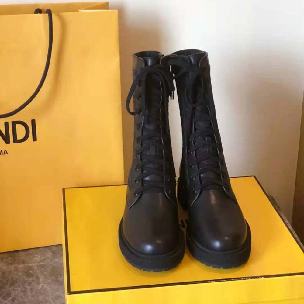 Close-up of gold-tone hardware on Fendi Women Signature Black Leather Biker Boots