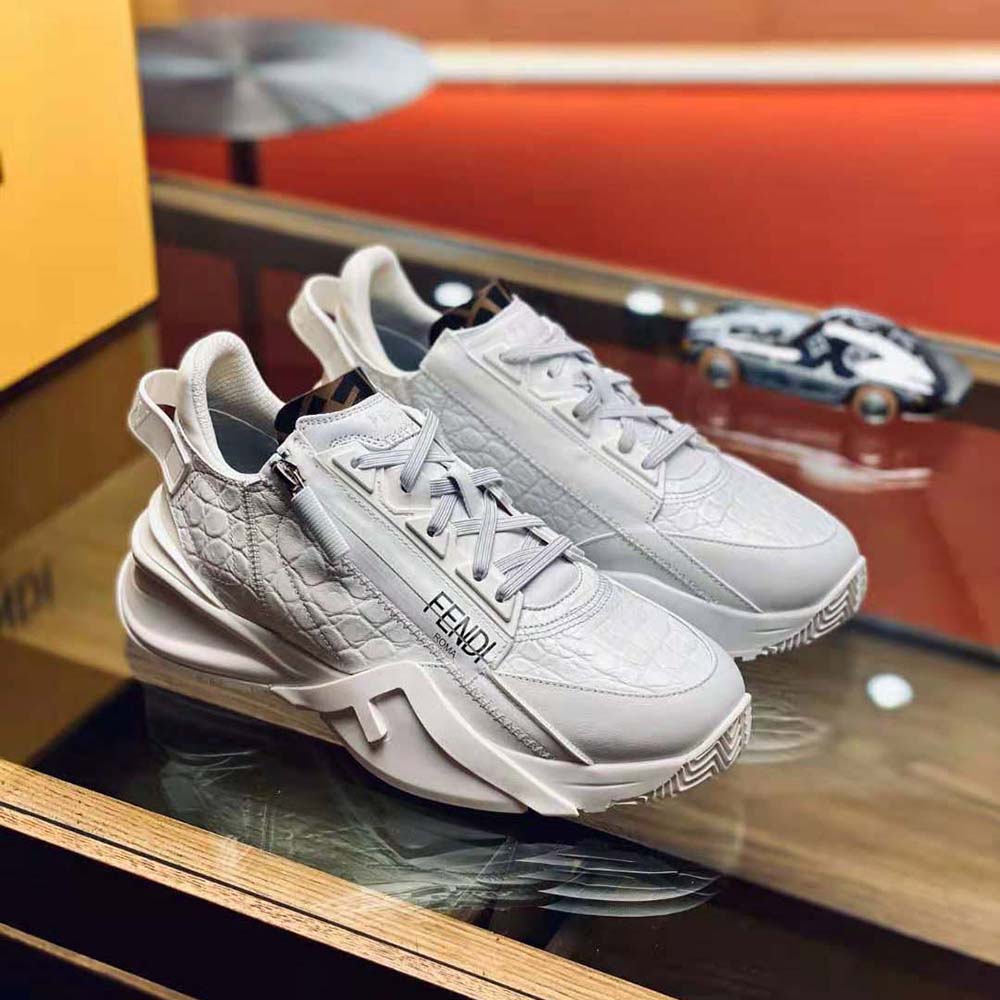 Close-up of lace closure and caiman leather detail on Fendi sneakers