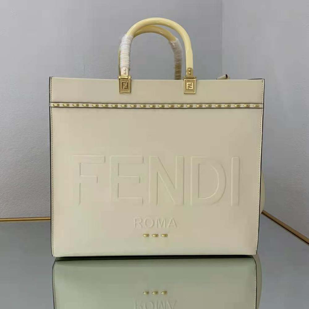 Close-up of silver-tone logo hardware on Fendi Women Sunshine Medium White Leather Shopper