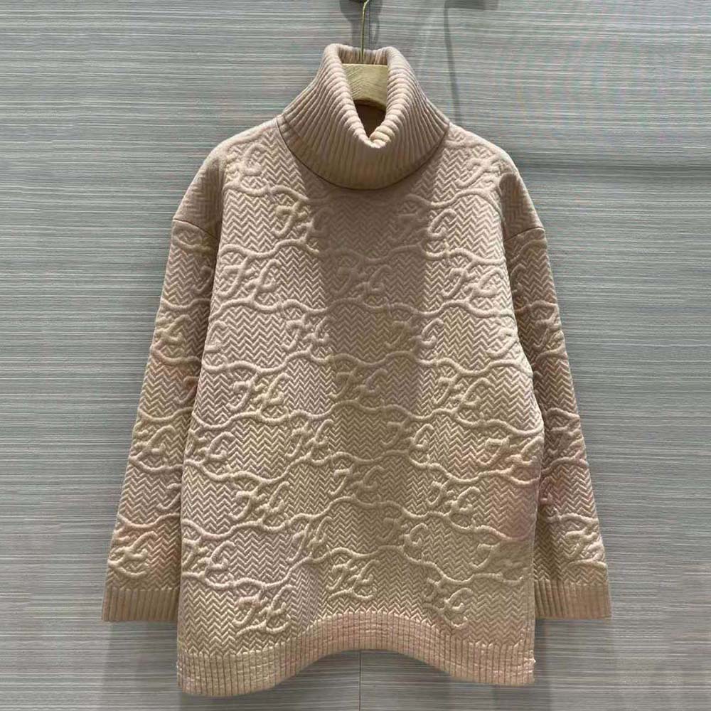 Close-up detail of ribbed cuffs on Fendi pink wool sweater