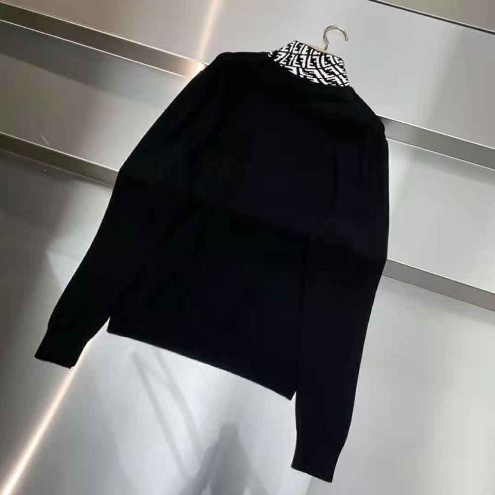 Side angle showing slim fit and sleeve logo detail on Fendi jumper